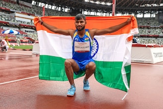 Praveen Kumar of Team India celebrates winning the silver medal after competing in the Men"s High Jump in the T-64 category final on Day 10 of the Tokyo 2020 Paralympic Games at the Olympic Stadium on September 03, 2021.