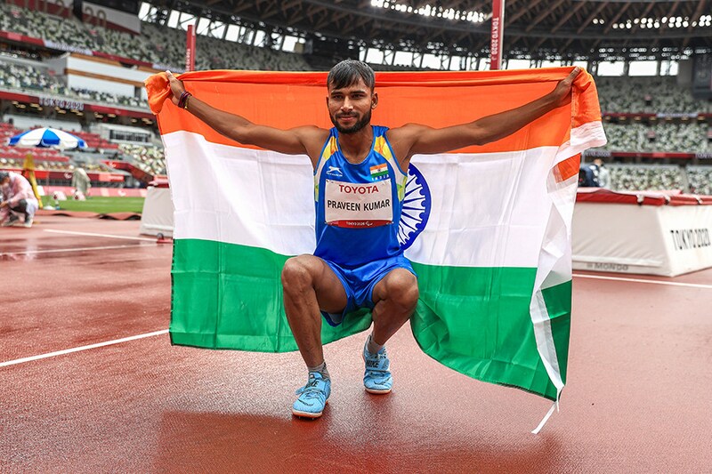 Praveen Kumar of Team India celebrates winning the silver medal after competing in the Men"s High Jump in the T-64 category final on Day 10 of the Tokyo 2020 Paralympic Games at the Olympic Stadium on September 03, 2021.