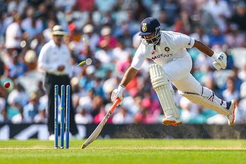 Rishabh Pant of India leaps to safety as the stumps are hit in a runout attempt by England during Day 4 of the fourth LV= Insurance Test match between England and India at The Kia Oval on September 05, 2021 in London, England. Pant made 50 runs off 106 balls before being caught and bowled by England"s Moeen Ali.