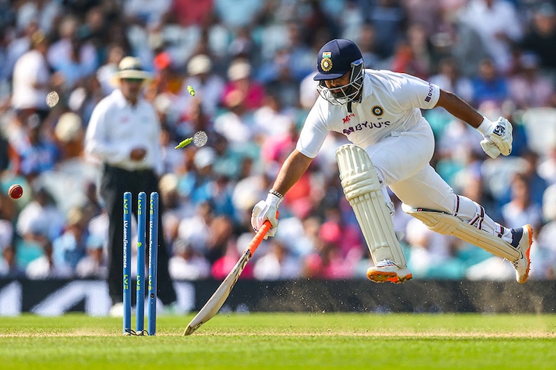 Rishabh Pant of India leaps to safety as the stumps are hit in a runout attempt by England during Day 4 of the fourth LV= Insurance Test match between England and India at The Kia Oval on September 05, 2021 in London, England. Pant made 50 runs off 106 balls before being caught and bowled by England"s Moeen Ali.