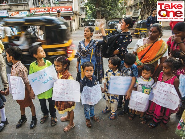 Residents of a Mumbai locality form a human chain to protest against the government move to resettle them next to a refinery and an industrial complex. Photo: Pratik Chorge / Hindustan Times via Getty Images