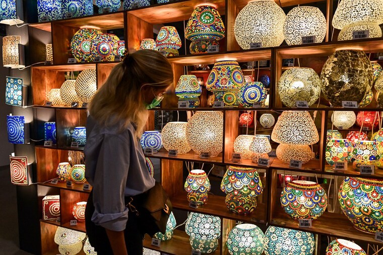 A visitor looks at lamps displayed at India World stand as a part of the "Super Salone" special event at the 2021 Salone del Mobile Milano, an international furnishing and design fair in Milan, Italy on September 7, 2021. Held during the Milan Design Week 2021, the "Super Salone" is scheduled to run from September 5 to September 10, 2021.