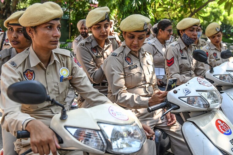Punjab police"s "Shakti Teams", a squad formed for women safety, waits before an official flag-off ceremony in Amritsar on September 14, 2021. The squad will be placed as decoys in plain clothes to curb incidents of eve-teasing at public places, especially in crowded areas such as near schools and colleges, and in buses.