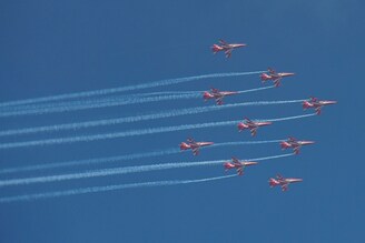 The Surya Kiran Aerobatic Team (SKAT) flies during an air show to mark the 50th Anniversary of India"s victory in the Indo-Pakistani War of 1971, in Jalandhar on September 18, 2021.