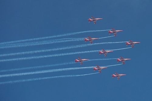 The Surya Kiran Aerobatic Team (SKAT) flies during an air show to mark the 50th Anniversary of India"s victory in the Indo-Pakistani War of 1971, in Jalandhar on September 18, 2021.