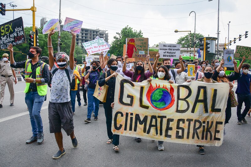 Protesters holding banners and placards participate in a protest march during a global climate strike, part of the "Fridays for Future" movement in New Delhi on 24th september 2021. Thousands joined in a coordinated action across the world, rallying to demand government action, a first since the start of the pandemic.