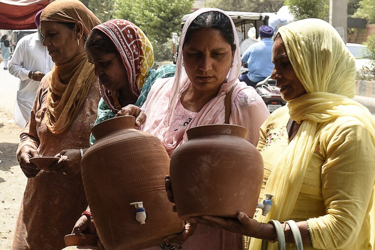 Matka, the simple earthen pot that cools drinking water, is a brisk selling item at a roadside stall in Amritsar on April 11, 2022. An intensifying heatwave, combined with unscheduled power cuts, left Amritsari residents reeling for hours on Sunday.