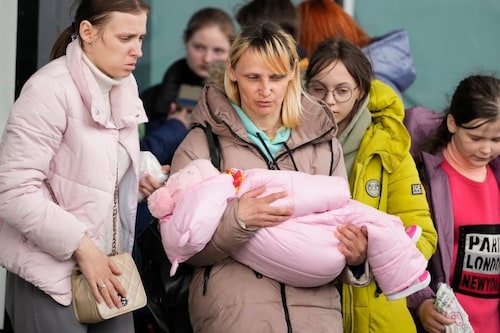 Refugee women with children walk to boarding transport at the central train station in Warsaw, Poland, Thursday, April 7, 2022. Image: AP Photo/Czarek Sokolowski Refugee women with children walk to boarding transport at the central train station in Warsaw, Poland, Thursday, April 7, 2022. Image: AP Photo/Czarek Sokolowski