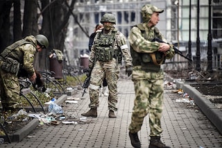 Russian soldiers walks along a street in Mariupol on April 12, 2022, as Russian troops intensify a campaign to take the strategic port city, part of an anticipated massive onslaught across eastern Ukraine, while Russia"s President makes a defiant case for the war on Russia"s neighbour. (Credit: Alexander NEMENOV / AFP)