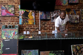 Forest Hayward organizes marijuana and other cannabis at his store the Sneaker Headz April 15, 2022, in Washington, DC. Buy a T-shirt, get a "gift" of weed: that"s how cannabis stores operate in Washington, exploiting a perceived loophole to sidestep a ban on selling the substance in the US capital. The situation is but one example of the knotty legality surrounding marijuana in America, despite a trend in recent years towards normalization.&nbsp(Credit: BRENDAN SMIALOWSKI / AFP)