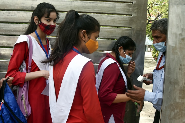 Thermal screening, masks, and pandemic related protocols were in place as students arrived for their CBSE board examinations for minor subjects at Dr BR Ambedkar School of Specialised excellence in Gandhi Nagar, New Delhi on April 26, 2022. The exams started on a cautious note as Delhi slipped back into the "orange" zone with an overall weekly test positivity rate of 5 percent.