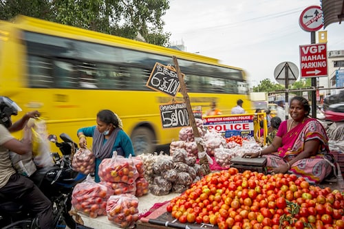 Produce hawker Amul Vasudevan, who was fined repeatedly for using throwaway bags, along a busy road in Chennai, India, July 7, 2022. India’s state of Tamil Nadu was not the country’s first to try to curtail plastic pollution, but unlike others it was relentless in enforcing its law. (Anindito Mukherjee/The New York Times)