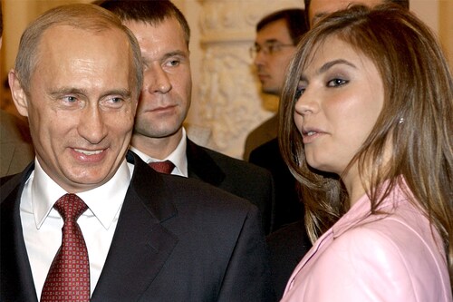 Russian President Vladimir Putin (L) smiles next to Russian gymnast Alina Kabaeva during a meeting with the Russian Olympic team at the Kremlin in Moscow, in this November 4, 2004 file photo. Image: Reuters&nbsp