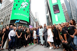Baiju Bhatt and Vlad Tenev pose in Times Square on Robinhood Markets IPO Listing Day on July 29, 2021 in New York City Image: Cindy Ord / GETTY IMAGES NORTH AMERICA / Getty Images via AFP
