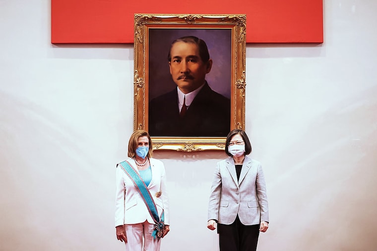 TAIPEI, TAIWAN - AUGUST 03: Speaker of the U.S. House Of Representatives Nancy Pelosi (D-CA), left, poses for photographs after receiving the Order of Propitious Clouds with Special Grand Cordon, Taiwan’s highest civilian honour, from Taiwan"s President Tsai Ing-wen, right, at the president"s office on August 03, 2022 in Taipei, Taiwan. Pelosi arrived in Taiwan on Tuesday as part of a tour of Asia aimed at reassuring allies in the region, as China made it clear that her visit to Taiwan would be seen in a negative light.