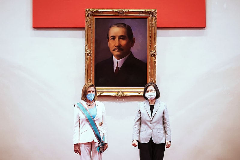 TAIPEI, TAIWAN - AUGUST 03: Speaker of the U.S. House Of Representatives Nancy Pelosi (D-CA), left, poses for photographs after receiving the Order of Propitious Clouds with Special Grand Cordon, Taiwan’s highest civilian honour, from Taiwan"s President Tsai Ing-wen, right, at the president"s office on August 03, 2022 in Taipei, Taiwan. Pelosi arrived in Taiwan on Tuesday as part of a tour of Asia aimed at reassuring allies in the region, as China made it clear that her visit to Taiwan would be seen in a negative light.