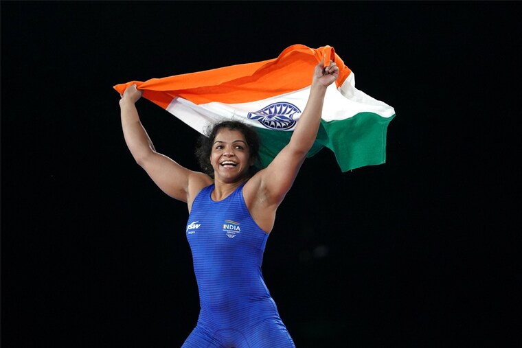 India"s Sakshi Malik celebrates after defeating Canada"s Ana Godinez Gonzalez during the Women"s Freestyle 62 kg Gold Medal match at the Coventry Arena on day eight of the 2022 Commonwealth Games.