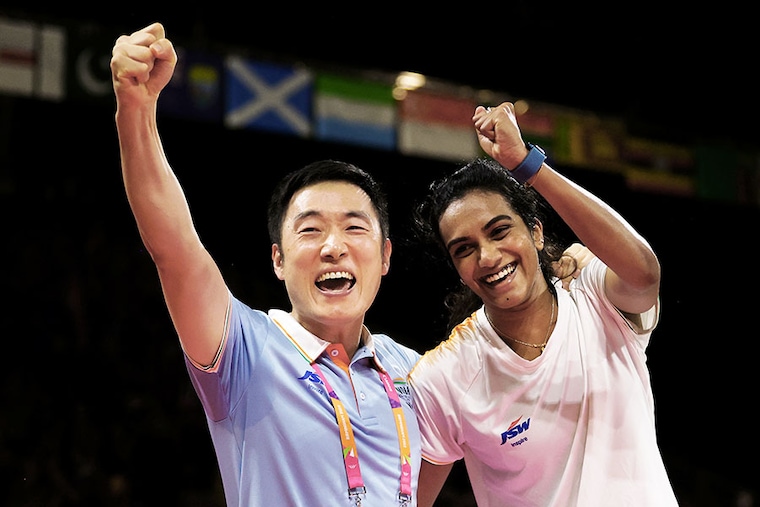 Pusarla Venkata Sindhu of Team India celebrates with Coach, Park Tae-sang, following victory over Michelle Li of Team Canada during the Badminton Women"s Singles Gold Medal Match on day eleven of the Birmingham 2022 Commonwealth Games at NEC Arena on August 08, 2022.