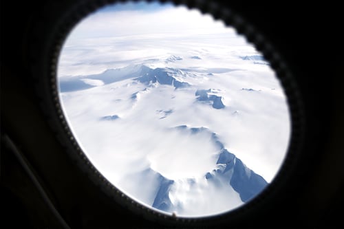 A file photo of Mountains and land ice seen from NASA"s Operation IceBridge research aircraft in the Antarctic Peninsula region, on November 4, 2017, above Antarctica. Image: Mario Tama/Getty Images