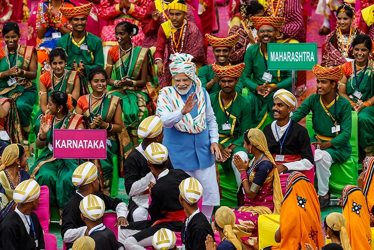 Prime Minister Narendra Modi meets with folk artists after addressing the nation on the Independence Day at the historic Red Fort in Delhi, India, August 15, 2022.