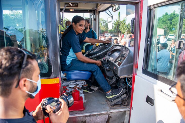 Bus driver Babita Devi, among the first batch of eleven women recruited as bus drivers by Delhi Transport Corporation, takes to the wheel at Rajghat Bus Depot, New Delhi. Delhi Transport authorities are planning to recruit two hundred women drivers as part of its effort to provide employment opportunities.