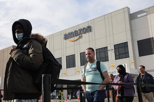 Workers coming out at Amazon"s JFK8 distribution center, in the Staten Island borough of New York City, U.S., March 25, 2022.  REUTERS/Brendan McDermid
