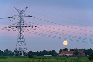 High voltage power lines in Wilhelmshaven, Germany, July 12, 2022. Facilities are being constructed there to receive shipments of liquefied natural gas. (Patrick Junker/The New York Times)