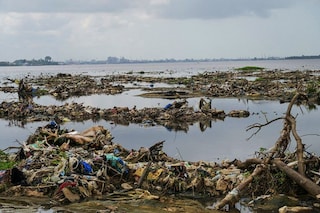 Urban and industrial waste from Yopougon, Abidjan"s biggest district, has transformed his village of 3,000 inhabitants into an open dump. Image: Sia KAMBOU / AFP