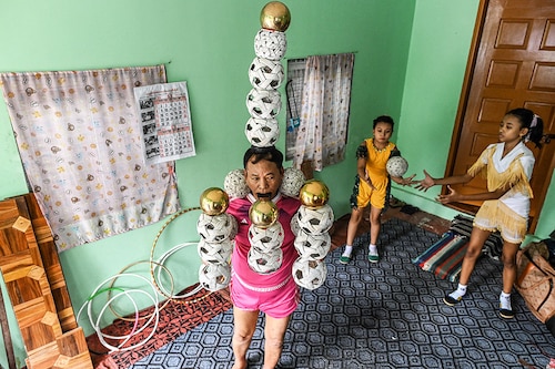 Ohn Myint started practising with Ywal in his 40s, immersing himself in the intense meditation it requires, as a way to restore movement to his limbs after he suffered a stroke. Image: STR / AFP