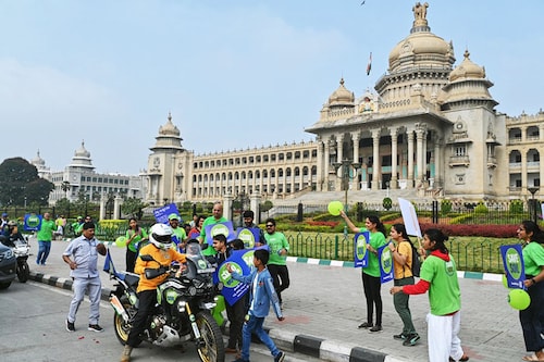 India"s yoga guru and Isha Foundation founder and spiritual proponent Jagadish "Jaggi" Vasudev, popularly known as Sadhguru, stops his motorcycle in front of the Vidhana Soudha to meet the participants of the "Save Soil" campaign, on the occasion of the World Soil Day, in Bengaluru on December 5, 2022.