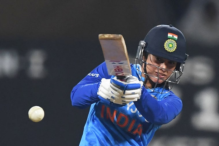 India"s Smriti Mandhana smashes a power-packed 79 during the thrilling second Twenty20 international cricket match between India and Australia at the DY Patil stadium in Navi Mumbai on December 11, 2022. A packed house of over 45,000 fans set a new record for the highest attendance in a women"s cricket match as India pipped Australia by 4 runs to level the T20 series.