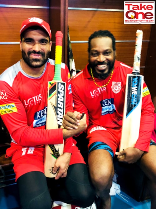 At the height of his career graph, Punjab Kings player Manzoor Dar (L) poses for a picture with his teammate, the legendary West Indies cricketer Chris Gayle after an IPL match in 2018.
Image: Courtesy Manzoor Dar At the height of his career graph, Punjab Kings player Manzoor Dar (L) poses for a picture with his teammate, the legendary West Indies cricketer Chris Gayle after an IPL match in 2018.
Image: Courtesy Manzoor Dar