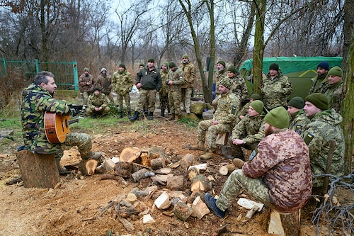Acclaimed Ukrainian singer Kolia Cerga performs for Ukrainian soldiers from the 59th brigade near the frontline on December 25, 2022, in Donetsk, Ukraine. Ukrainians celebrate Catholic Christmas on December 25 because the Orthodox Christmas on January 7 is considered a Russian tradition.