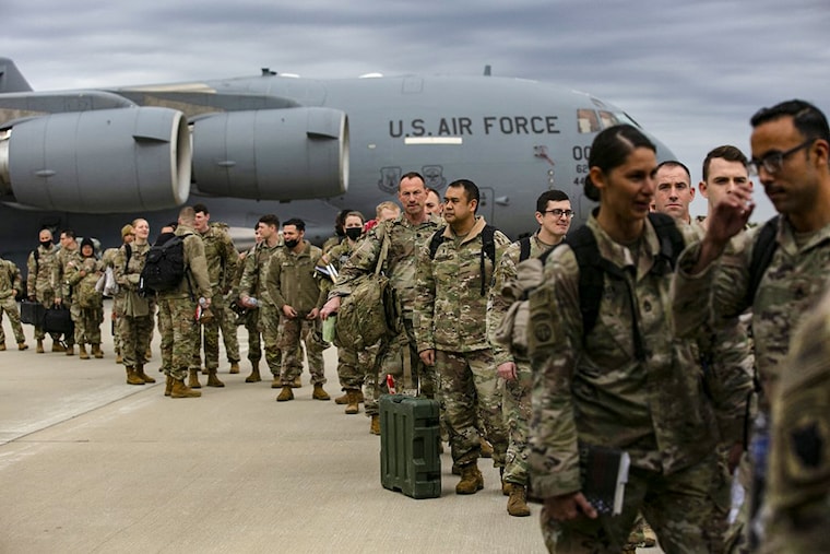 US troops deploy for Europe from Pope Army Airfield at Fort Bragg, North Carolina, on February 3, 2022. - The US plans to deploy 3,000 troops to fortify NATO forces in Eastern Europe amid fears Russia could invade Ukraine, the Pentagon said Wednesday. About 1,000 US troops stationed in Germany will be moved eastward to Romania while 2,000 more will deploy to Poland and Germany from the US.