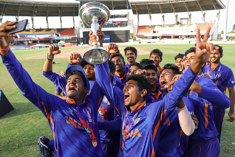 Yash Dhull, captain of India Under-19 cricket team celebrates ICC U19 Men"s World Cup Trophy win at Sir Vivian Richards Stadium with his teammates on February 05, 2022 in Antigua. India defeated England by four wickets to clinch the title for a record fifth time.