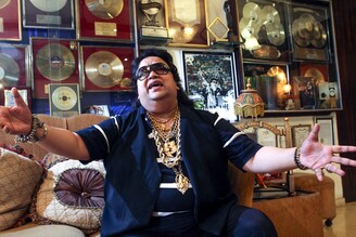 A file photo of Bollywood singer and music composer Bappi Lahiri at his residence in Juhu, Mumbai. Popularly known as the "Disco King", Bappi Lahiri, who collaborated with the likes of Snoop Dogg and Samantha Fox, has died aged 69, in Mumbai on February 16, 2022