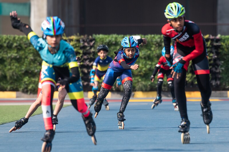 Participants in action during India"s first rooftop speed skating championship at Jio World, BKC, on February 26, 2022, in Mumbai, India. Exhibiting their speed and style on a 240-m circuit against a panoramic view of the Mumbai skyline, the skaters will participate in events across professional speed inline and quad skating, over two days.