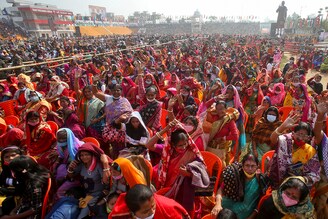 People wave as they attend a rally addressed by Prime Minister Narendra Modi, during the ongoing coronavirus disease (COVID-19) pandemic, in Agartala, India, January 4, 2022.