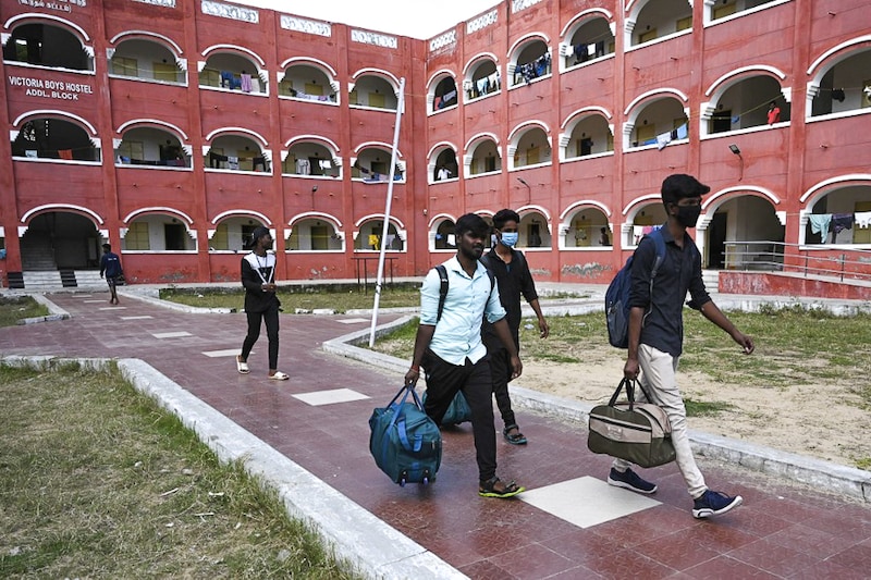 Students from Presidency college vacate their college hostel after a sudden surge in cases of Omicron variant of Covid-19 in Chennai on January 6, 2021. Students nationwide are stressed from disruption of regular classes since the arrival of the virus.