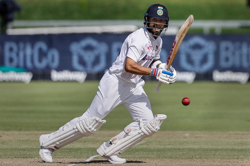 India"s Virat Kohli plays a classic shot during the first day of the third Test cricket match between South Africa and India at Newlands stadium in Cape Town on January 11, 2022. Displaying masterful control, Virat"s patient knock of 79 runs was his highest test score since Dec 2019.