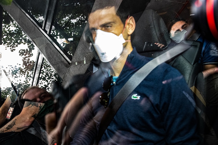 Serbian tennis player Novak Djokovic leaves the Park hotel on January 16, 2022 in Melbourne, Australia. Djokovic was in detention and faced deportation after his visa was cancelled by the Australian government. After losing a legal battle on January 16 in Australia to stay and play in the Australian Open tennis tournament over his coronavirus vaccination status, he took a flight for Dubai on 17th January.