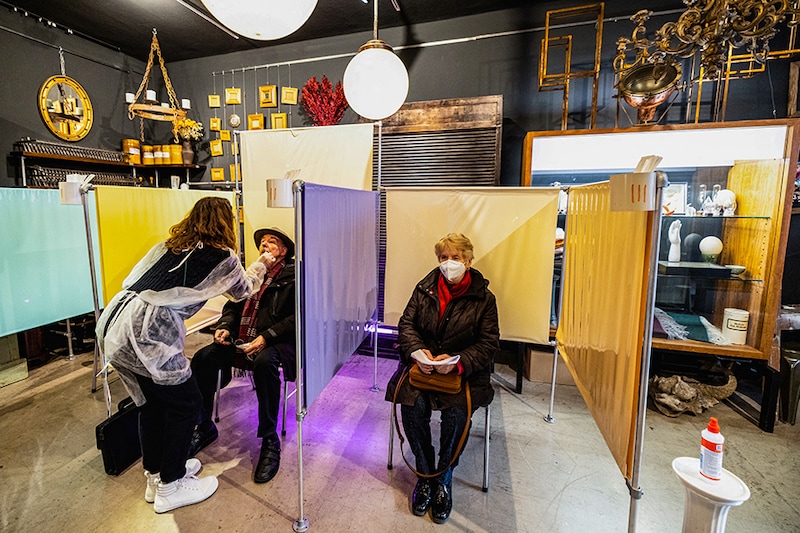 Judith Johanna Pawelke takes a coronavirus disease (COVID-19) test in her interior design store, which is currently being used as a COVID-19 test station in downtown Munich, Germany, January 19, 2022.