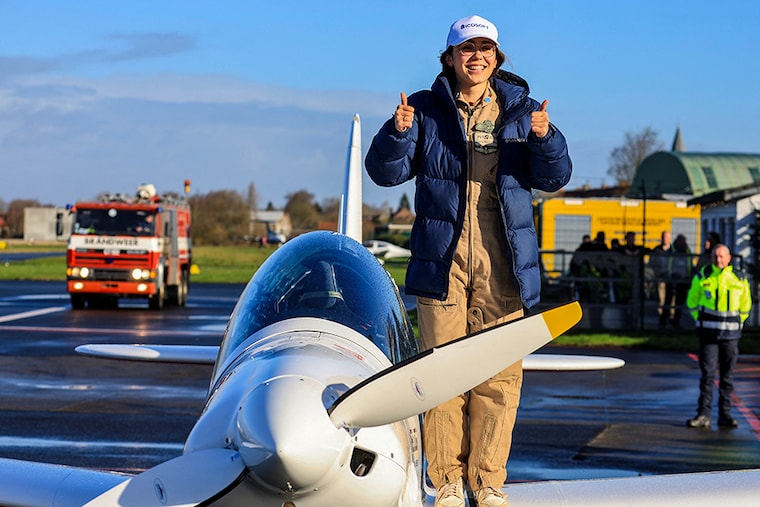 Belgian-British pilot Zara Rutherford, 19, gestures following her landing at Kortrijk-Wevelgem Airport, after a round-the-world trip in a light aircraft, becoming the youngest female pilot to circle the planet alone, in Wevelgem, Belgium, January 20, 2022.