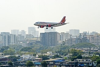 An Air India aircraft prepares to land at the Chhatrapati Shivaji Maharaj International Airport in Mumbai on January 27, 2022. The government on Thursday officially handed over Air India to the Tata group, a strategic disinvestment transaction that concluded with the transfer of 100 per cent shares of Air India to Tatas.