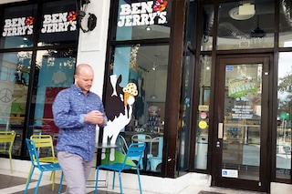 A person walks past a Ben &amp Jerry"s ice cream store on September 23, 2021 in Miami, Florida. In July last year, Vermont-based Ben &amp Jerry"s announced it would no longer sell its ice cream in the Israeli-occupied Palestinian territories, which the Jewish state seized in 1967, saying it was "inconsistent with our values," although it said it planned to keep selling its products in Israel. Image: JOE RAEDLE / GETTY IMAGES NORTH AMERICA / Getty Images via AFP
