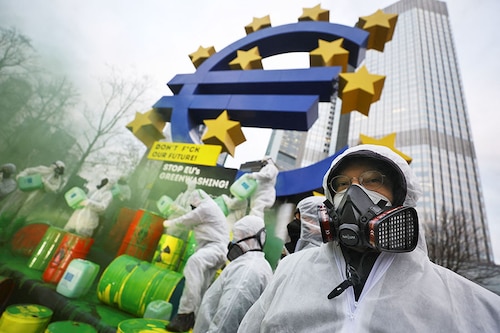 A file photo of demonstrators take part in a protest against the greenwashing of nuclear energy and gas through the taxonomy of the EU in front of the Euro sign in Frankfurt, Germany, in early January, 2022. Image:&nbspKai Pfaffenbach / Reuters