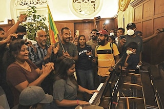 A woman plays a piano inside the Sri Lanka"s presidential palace, in Colombo on July 10, 2022, a day after it was overrun by anti-government protestors. Sri Lanka"s colonial-era presidential palace has embodied state authority for more than 200 years, but on July 10 it was the island"s new symbol of "people power" after its occupant fled. Image:&nbspArun Sankar / AFP