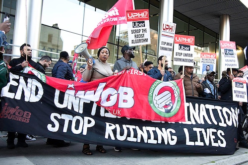 A file photo of Uber drivers" strike, holding a banner and placards at Uber"s headquarters in London, October 6, 2021. during the demonstration. Uber drivers demand better rate per mile, 15% max commission, transparency of charges on customers, no fixed rate trips, among other things. Image: Loredana Sangiuliano/SOPA Images/LightRocket via Getty Images A file photo of Uber drivers" strike, holding a banner and placards at Uber"s headquarters in London, October 6, 2021. during the demonstration. Uber drivers demand better rate per mile, 15% max commission, transparency of charges on customers, no fixed rate trips, among other things. Image: Loredana Sangiuliano/SOPA Images/LightRocket via Getty Images