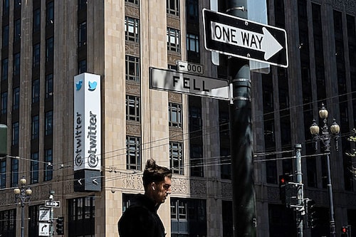In this file photo taken on April 26, 2022 a person walks past the Twitter headquarters in downtown San Francisco, California. Elon Musk pulled the plug on his deal to buy Twitter on July 8, 2022, accusing the company of "misleading" statements about the number of fake accounts, a regulatory filing showed. Image: Amy Osborne / AFP In this file photo taken on April 26, 2022 a person walks past the Twitter headquarters in downtown San Francisco, California. Elon Musk pulled the plug on his deal to buy Twitter on July 8, 2022, accusing the company of "misleading" statements about the number of fake accounts, a regulatory filing showed. Image: Amy Osborne / AFP