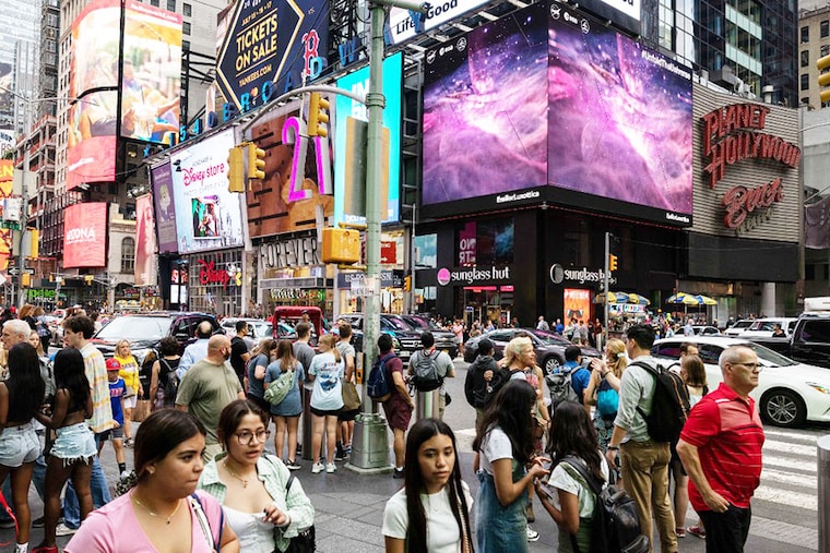 Images captured by The James Webb Space Telescope (JSWT) are displayed on screens at Times Square, New York on July 12, 2022. Released one by one starting from 10:30 am Eastern (1430 GMT) at the Goddard Space Flight Center, the new images demonstrated the full power of the $10 billion observatory, which uses infrared cameras to gaze into the distant universe with unprecedented clarity. The JWST is the most powerful telescope launched into space and it reached its final orbit around the sun, approximately 930,000 miles from Earth"s orbit, in January 2022.